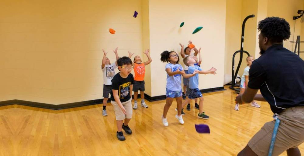 Elementary aged students engaged in a physical education activity