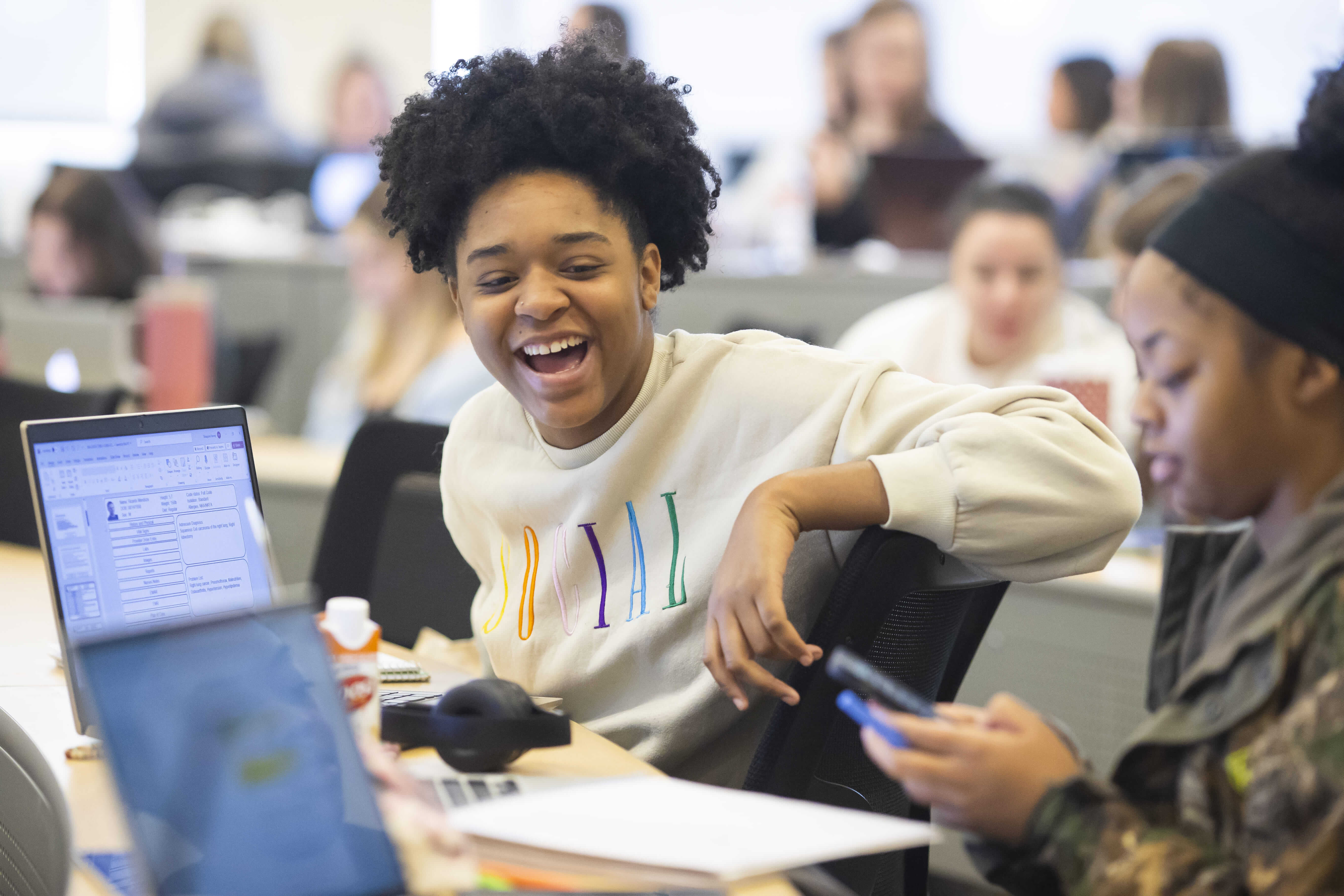 Student laughing in class