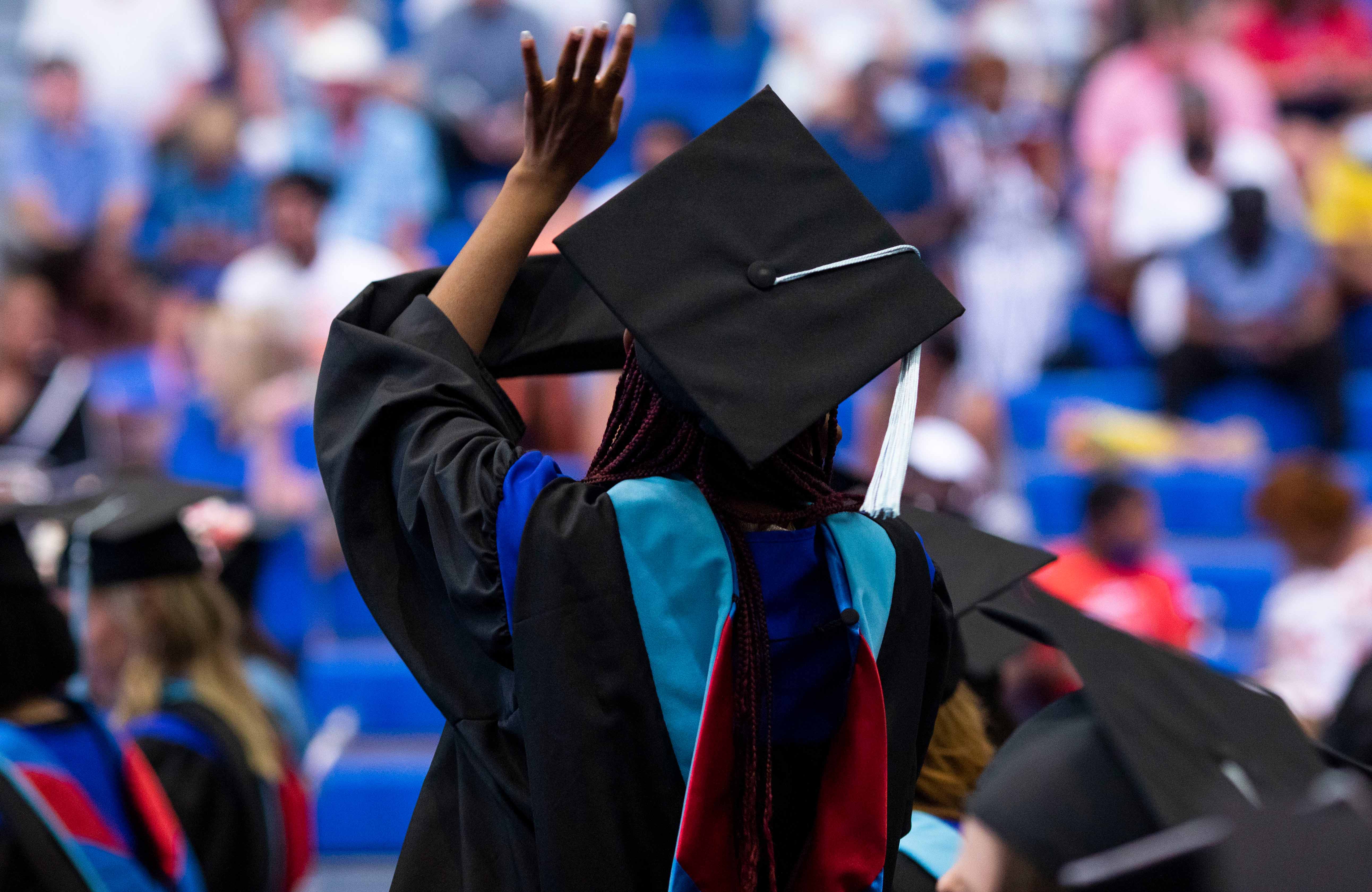 graduate waving