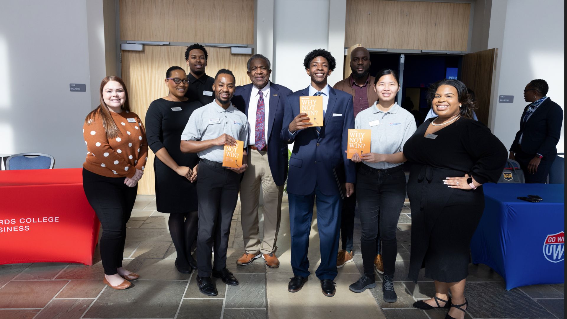 Larry and students holding book