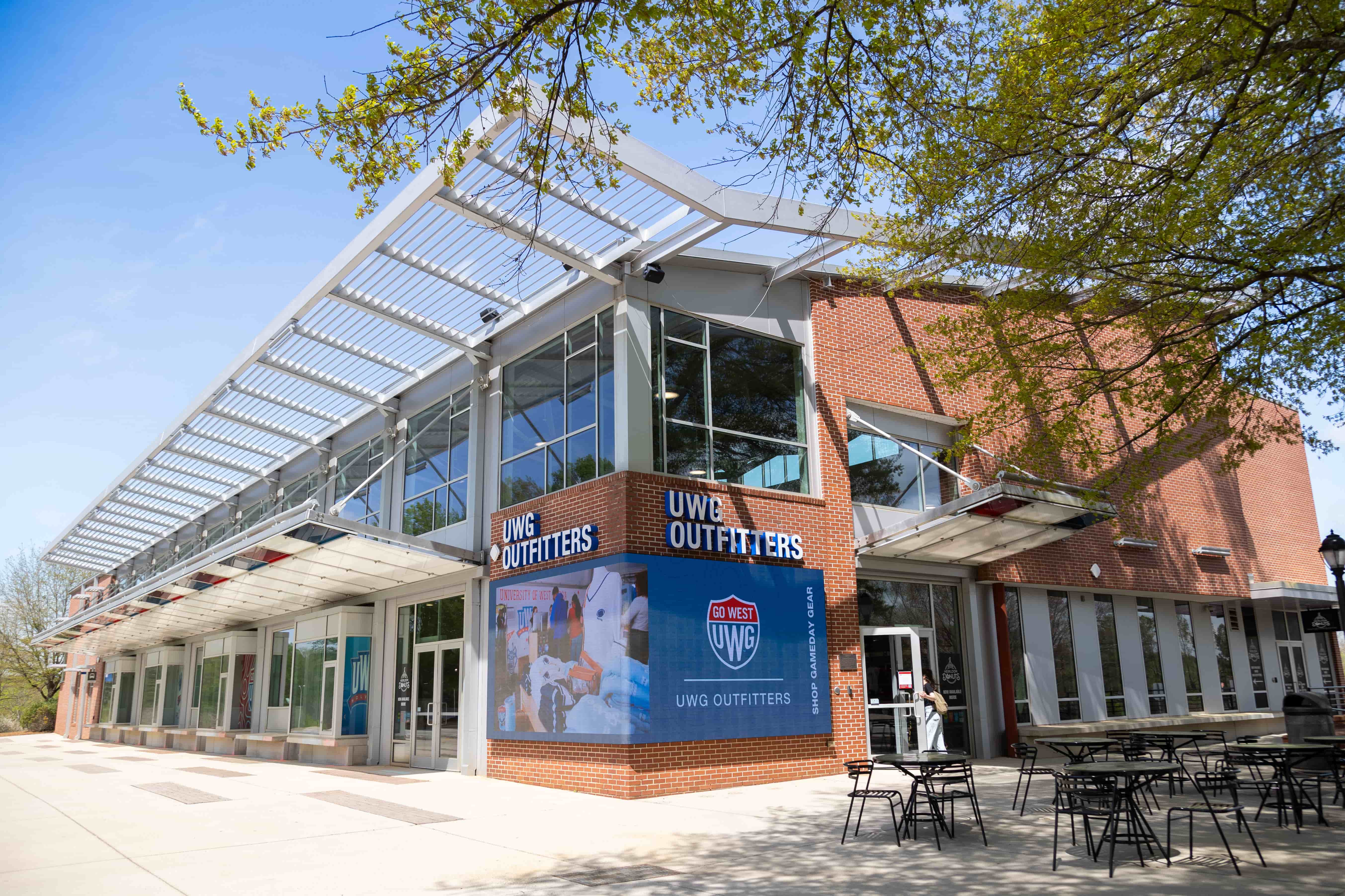 UWG Outfitters Exterior featuring new wrap around signage by the entryway.