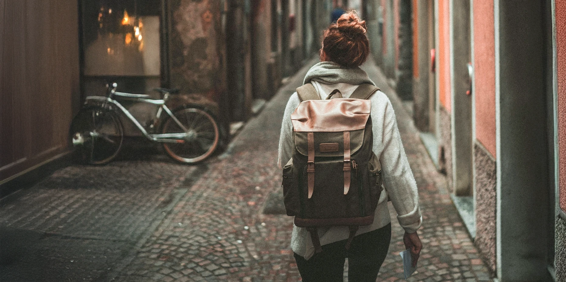 student in walking down European street