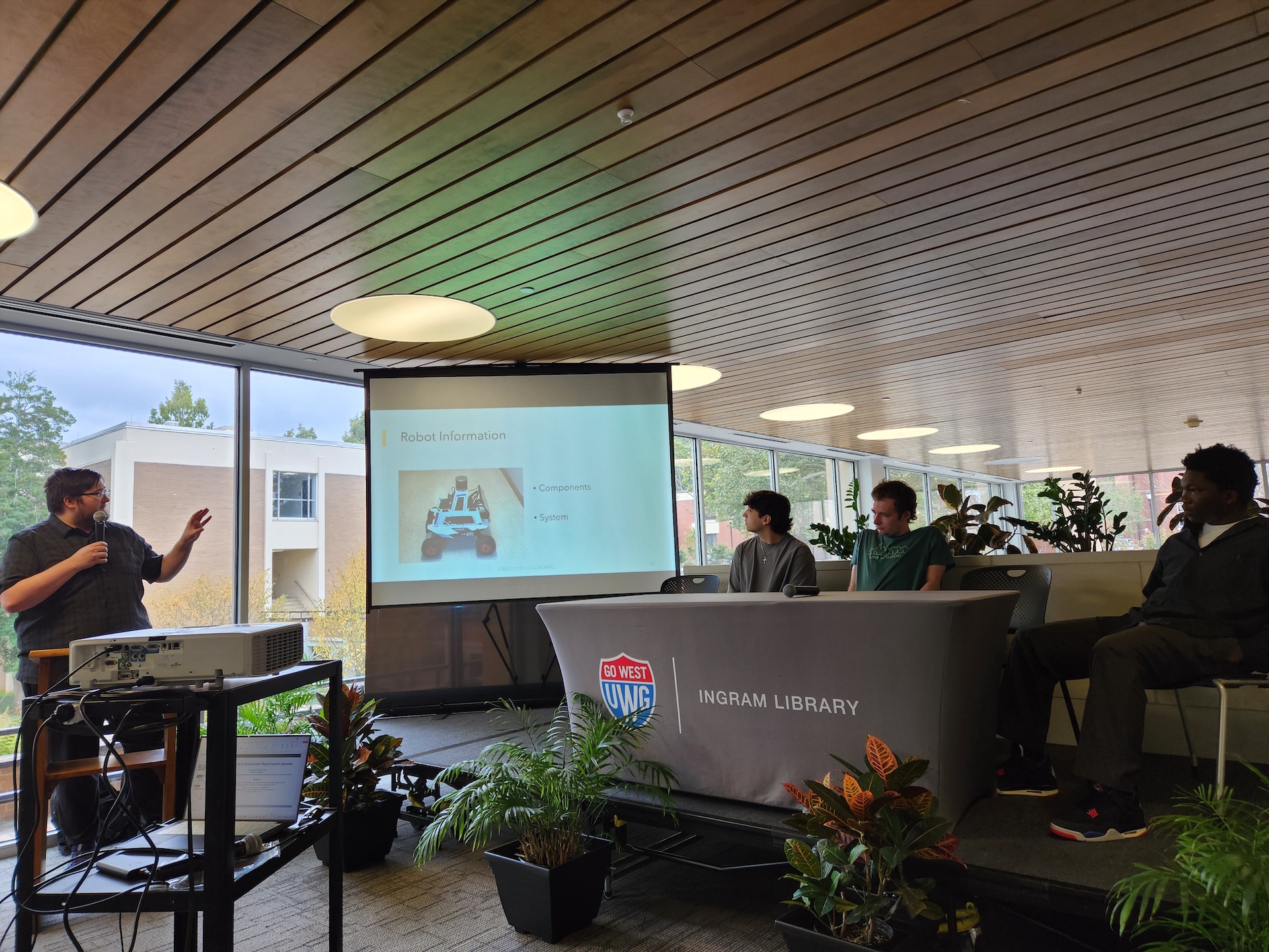 Students participating in panel presentation for World AI Week 2025 at UWG Ingram Library