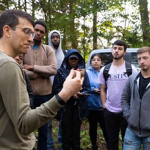 Professor Edelman and students outdoors