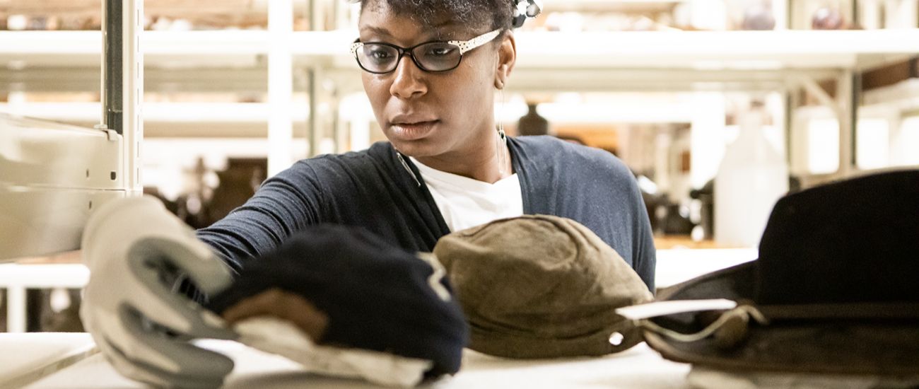 participant examining artifacts