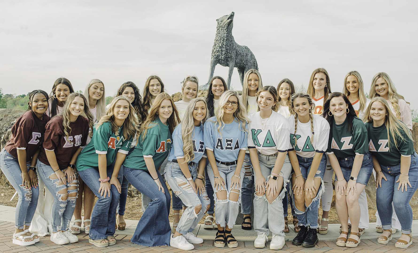 fraternity and sorority students in greek village