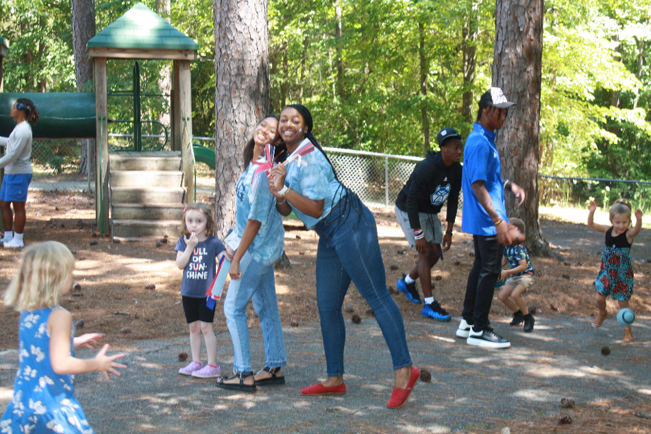 Pre-K students and teachers on the playground.