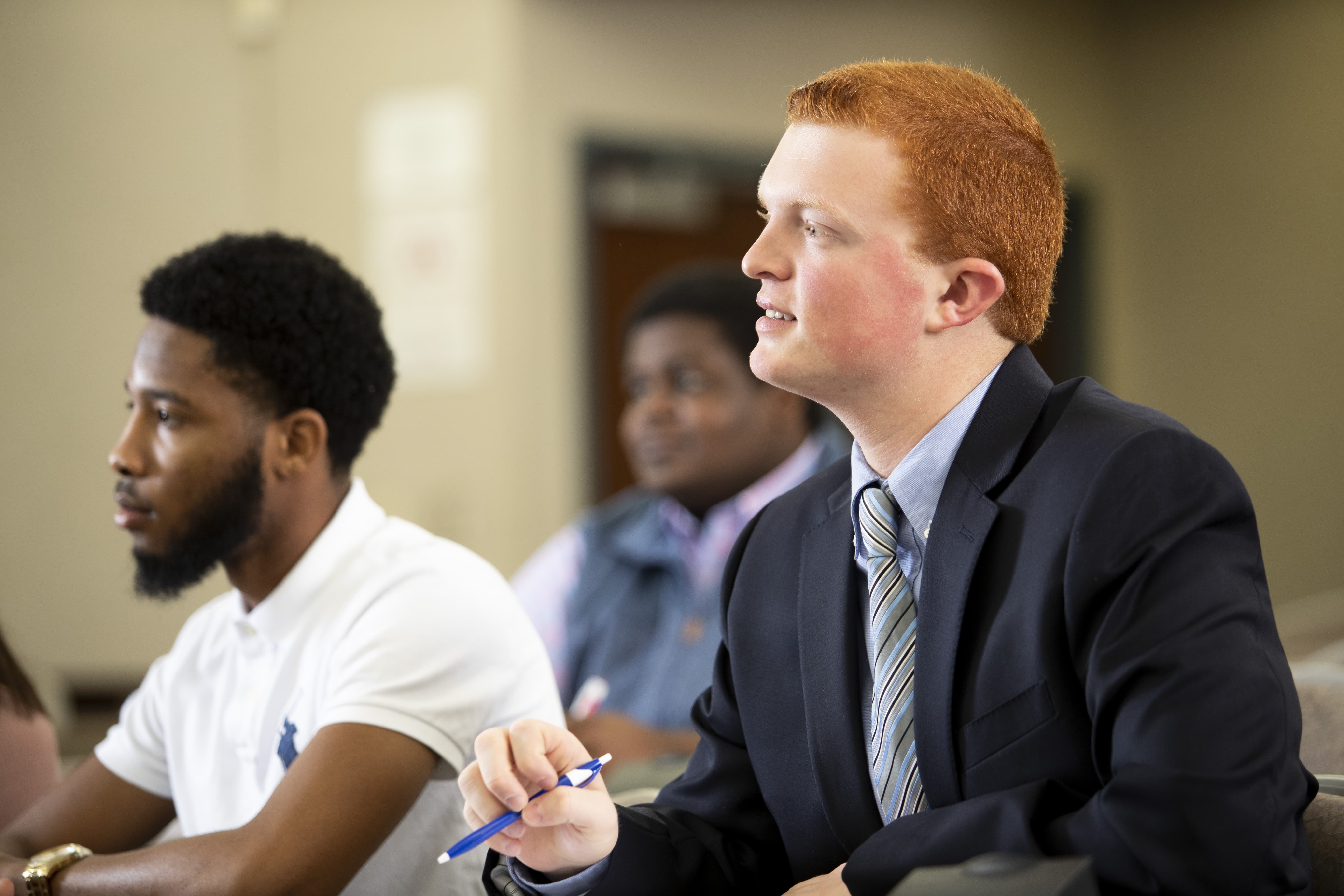 Business students dressed in professional attire.