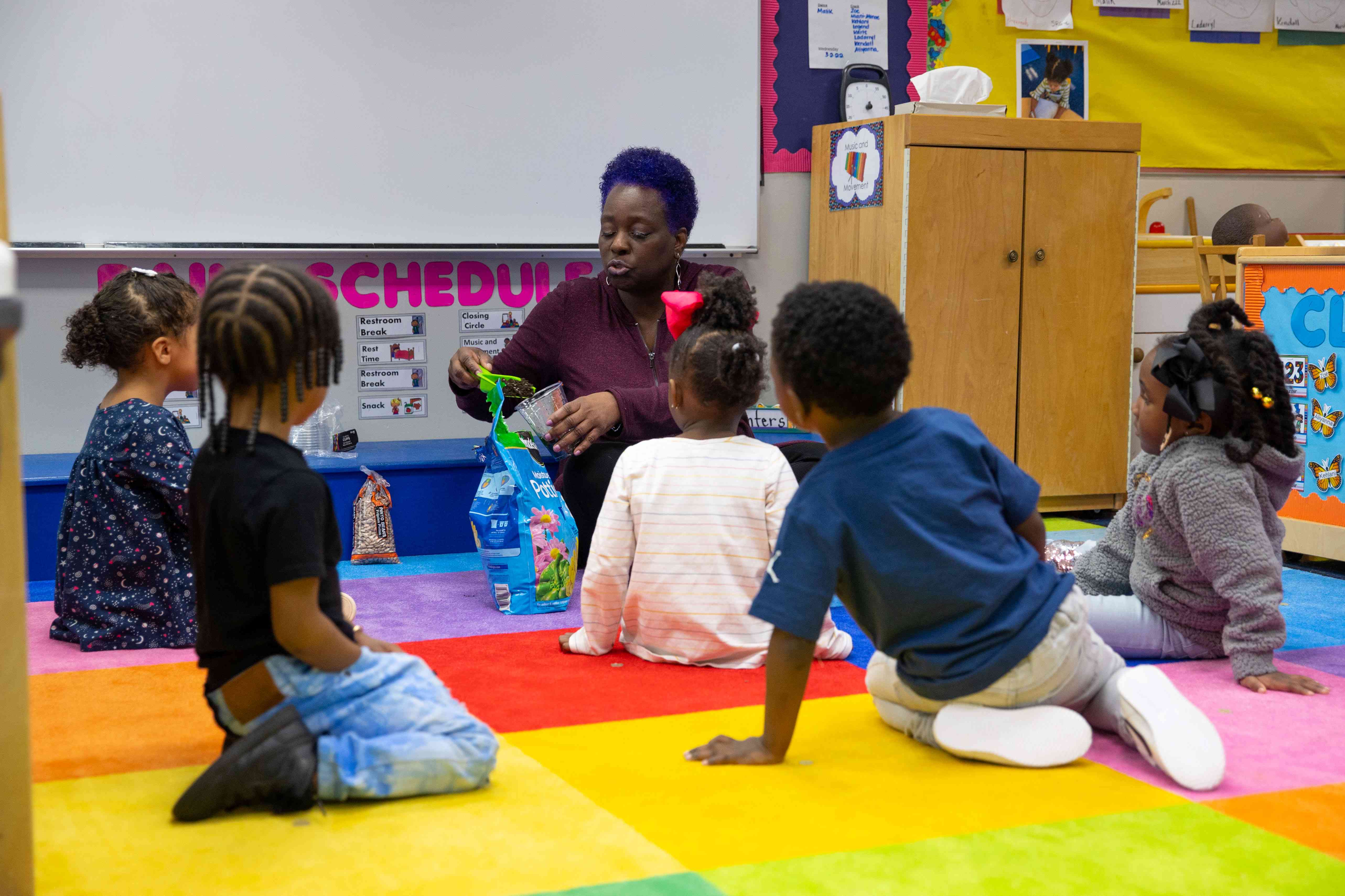 Graduate student working with a child in an instructional setting