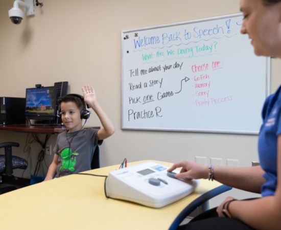 Student testing a child's hearing
