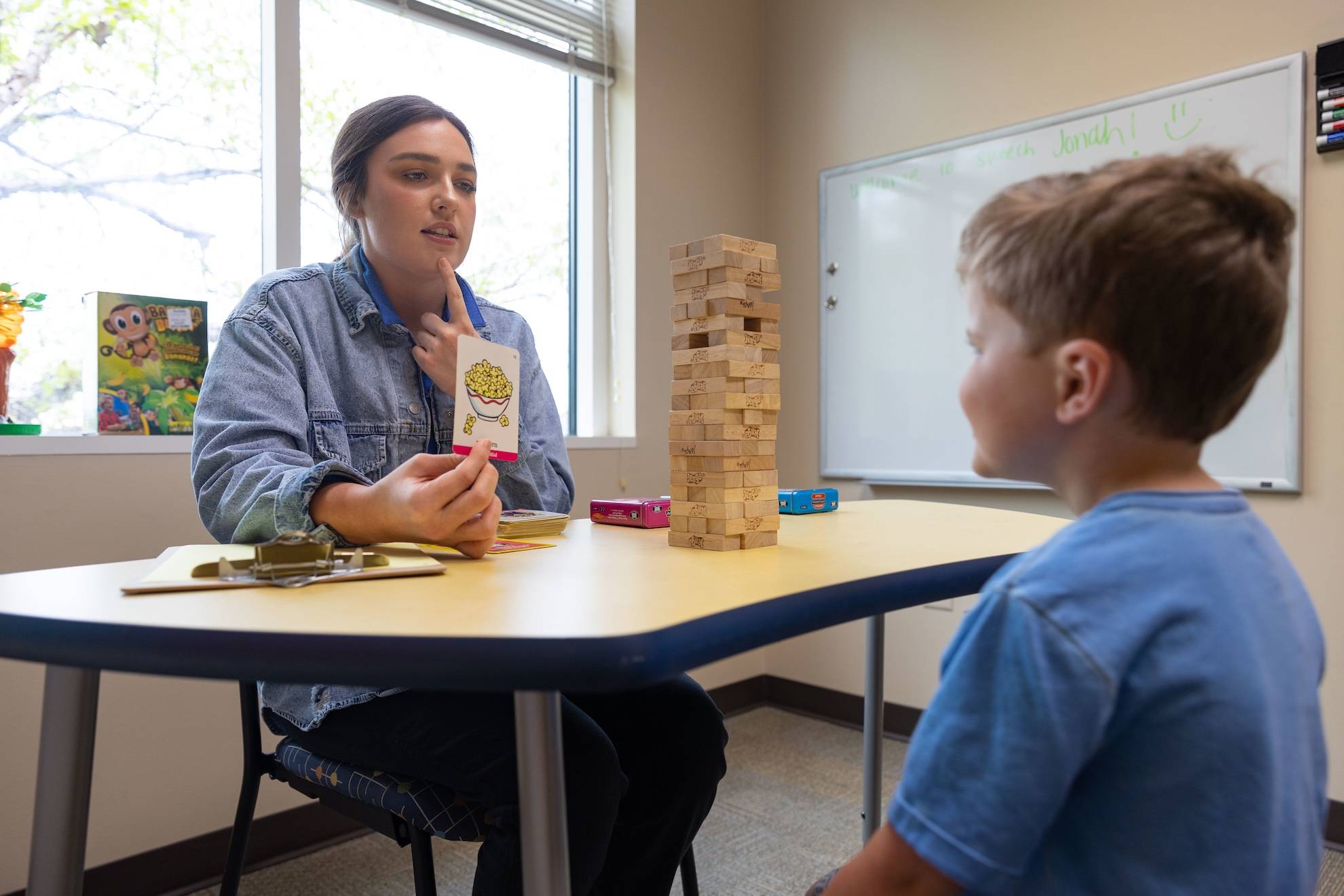a child with a speech therapist