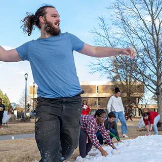 A student about to throw a snow ball.