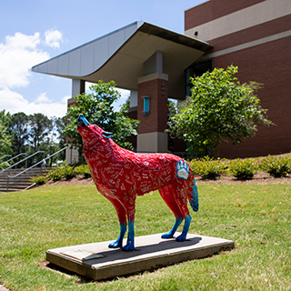 Red wolf statue on-campus.
