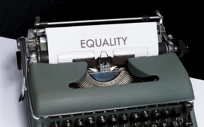 Typewriter with paper titled Equality