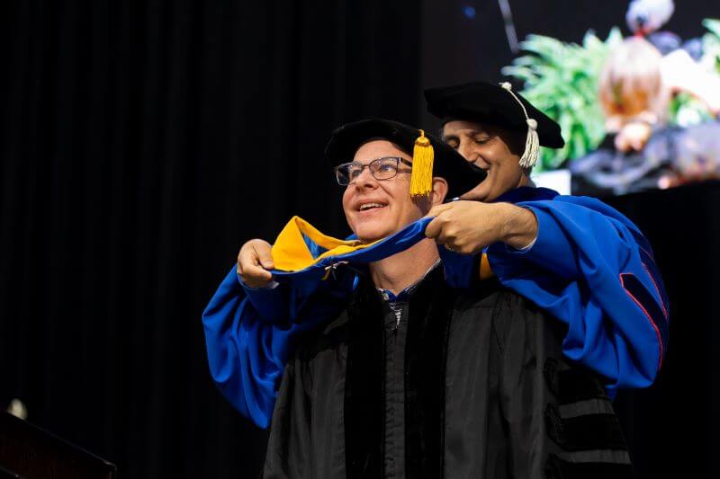The hooding of Dr. Rusty West