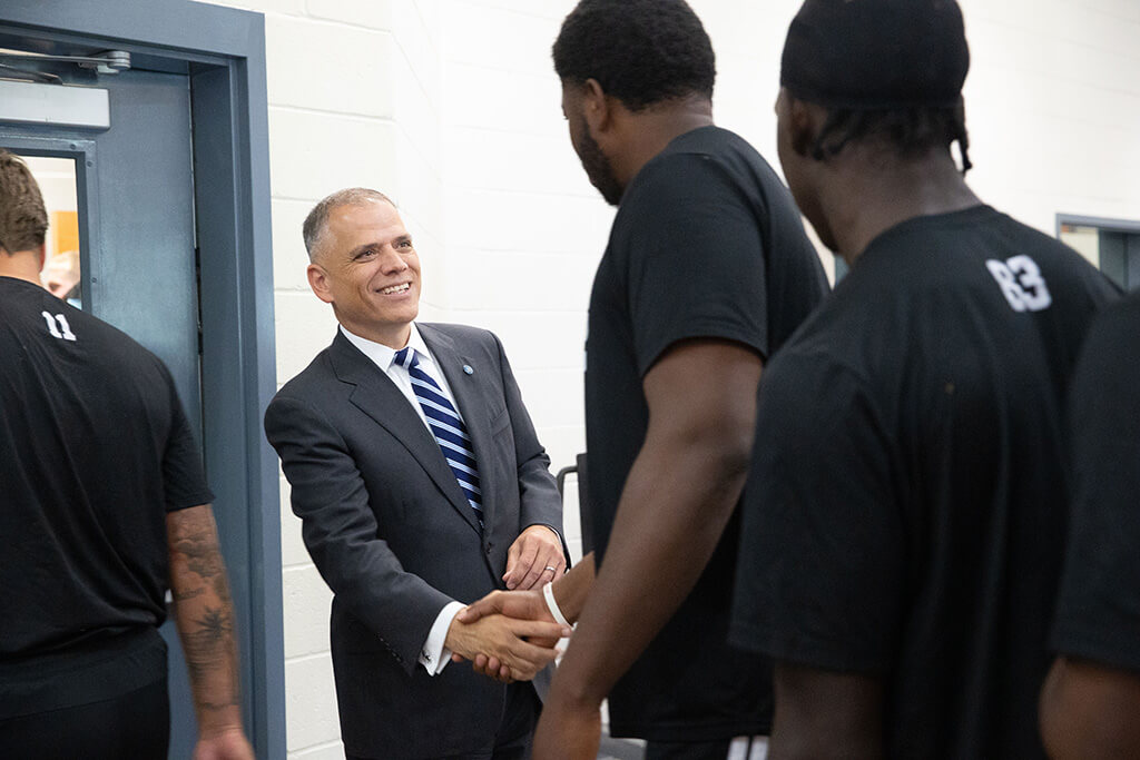 Dr. Michael Johnson meets UWG Wolves football players