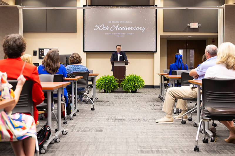 Dr. Mike Dishman, dean, speaks during the College of Education's 50th anniversary celebration