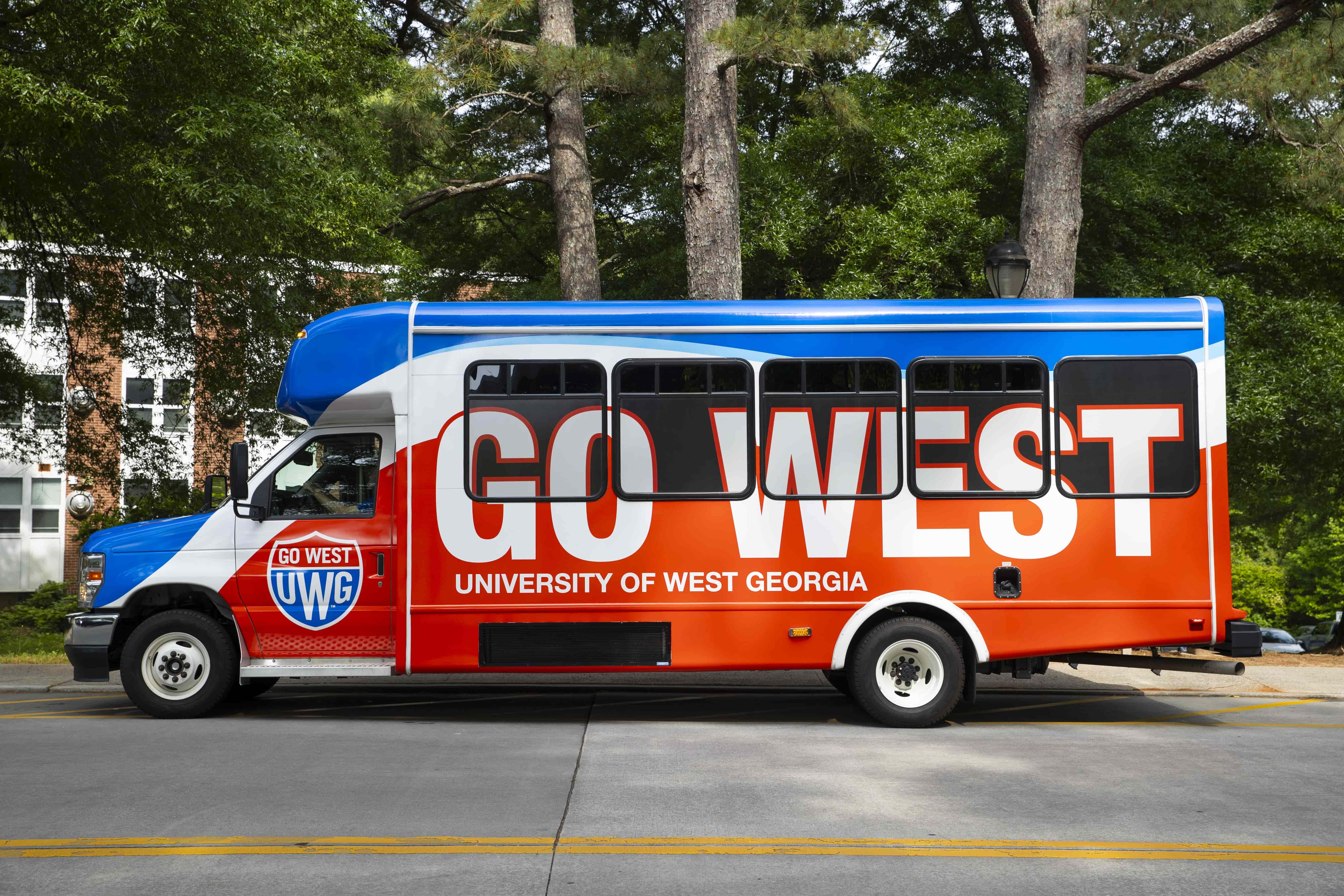 UWG buses parked on the street. 