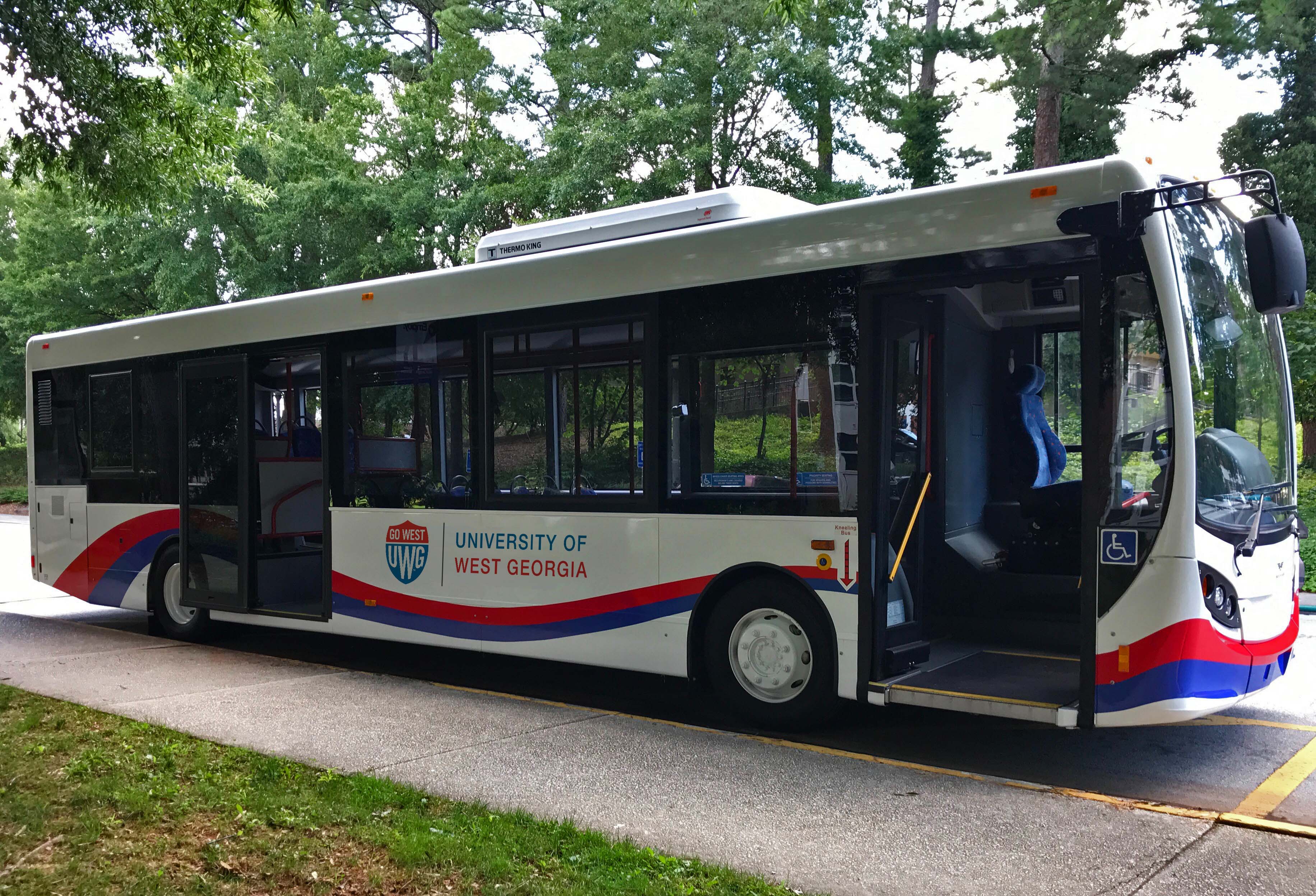 UWG buses parked on the street. 