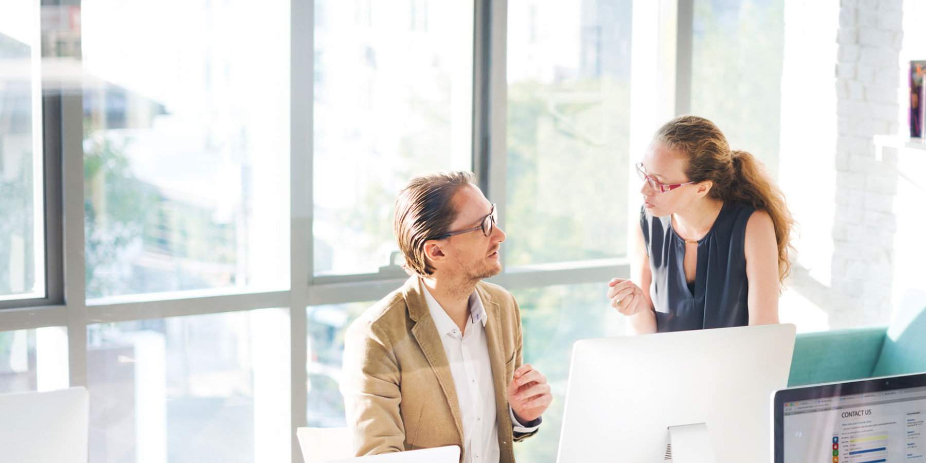 two people talking in a business setting