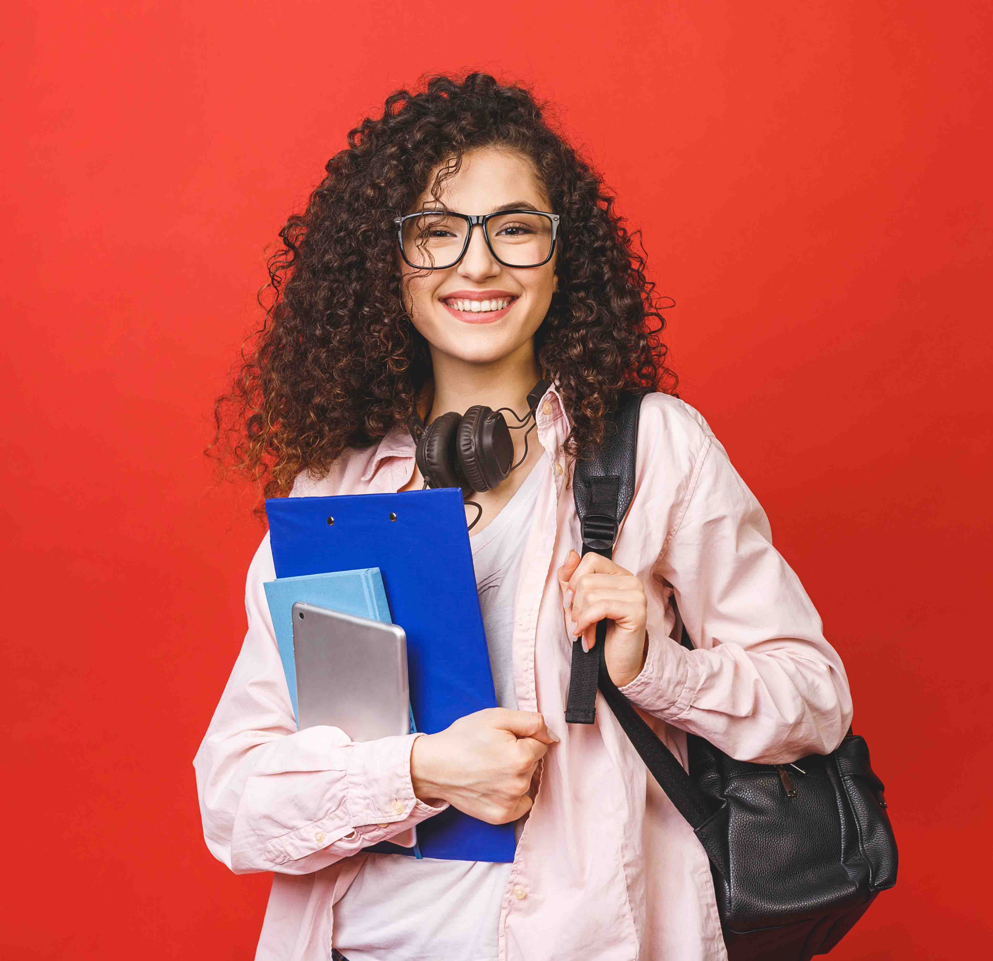 Woman with a backpack and notebooks