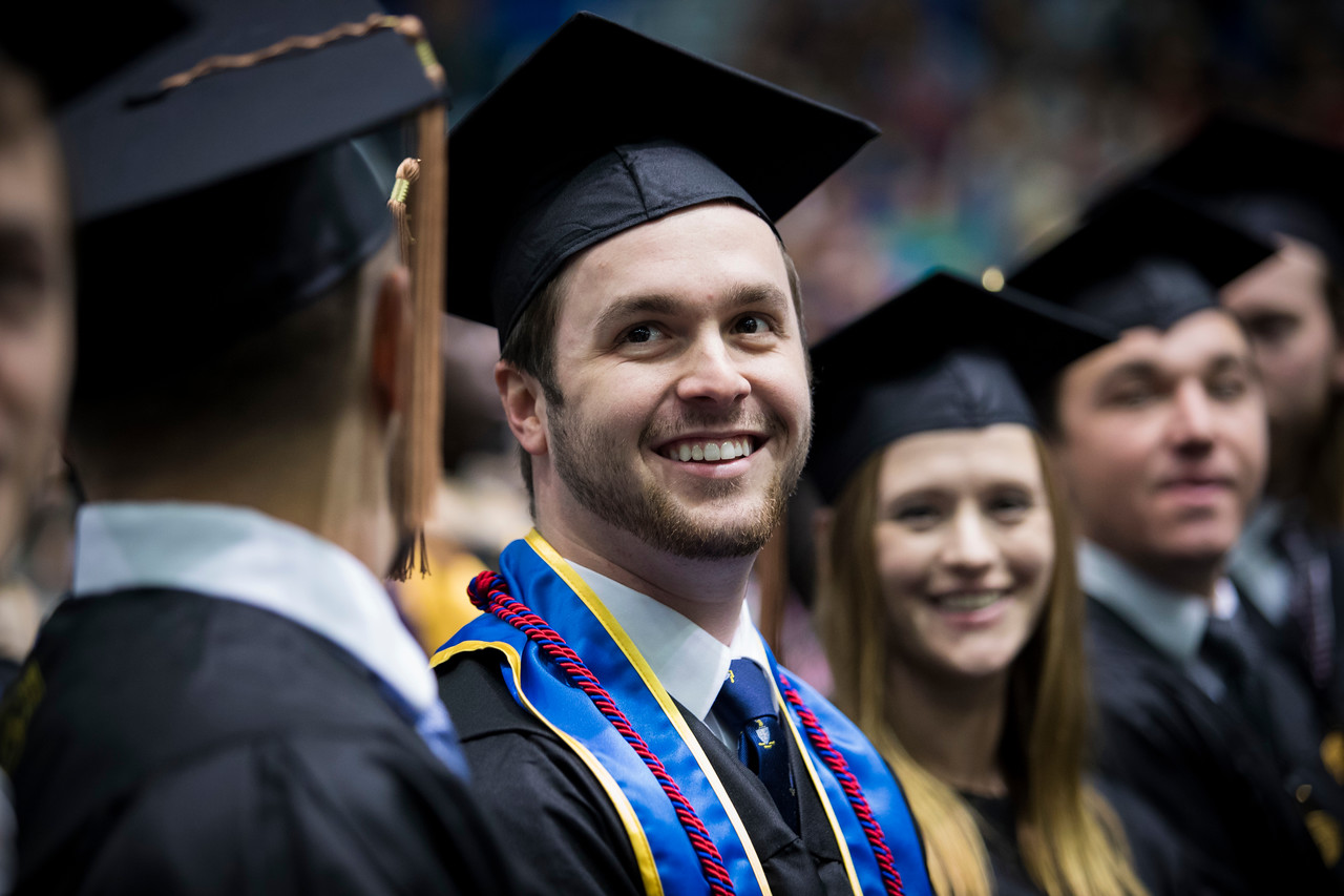 graduates at commencement