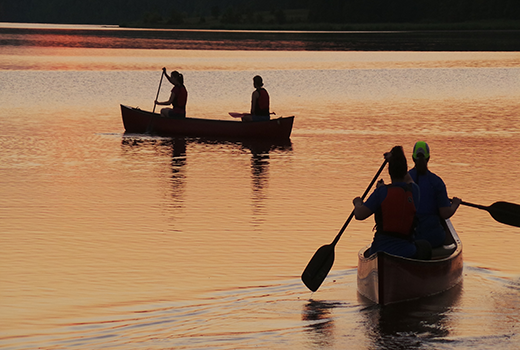 Students paddling at sunset at John Tanner