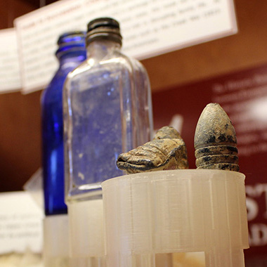 bottles and other artifacts in case