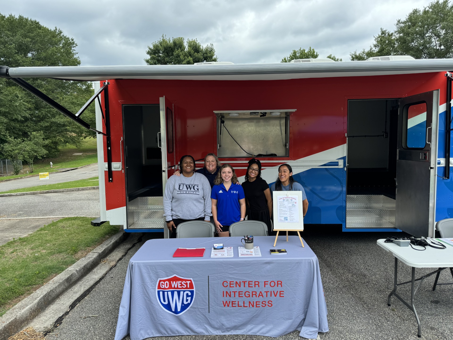 Chief Wellness Officer, Bridgette Stewart, with Students at Coweta County Health Fair