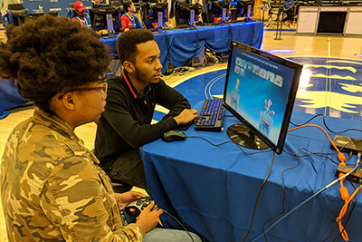 A female UWG student chooses her character during a video game competition
